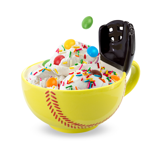 The Softball Mug with a Glove! START YOUR MORNINGS WITH FUN! Play with your food with this original yellow softball mug with an attached glove. Perfect for scoring mini marshmallows into cocoa, cereal into milk, crackers into soup, or toppings onto ice cream! Something to root for in your morning routine!