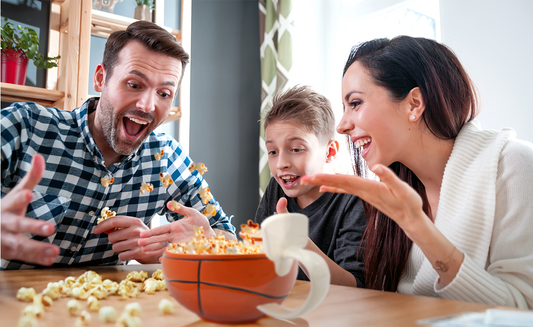 Family enjoying playful moment tossing cereal into sports mug with mini basketball hoop attachment